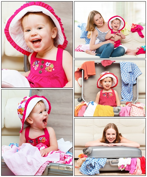 Happy baby girl is going on trip, pack suitcase - Stock Photo